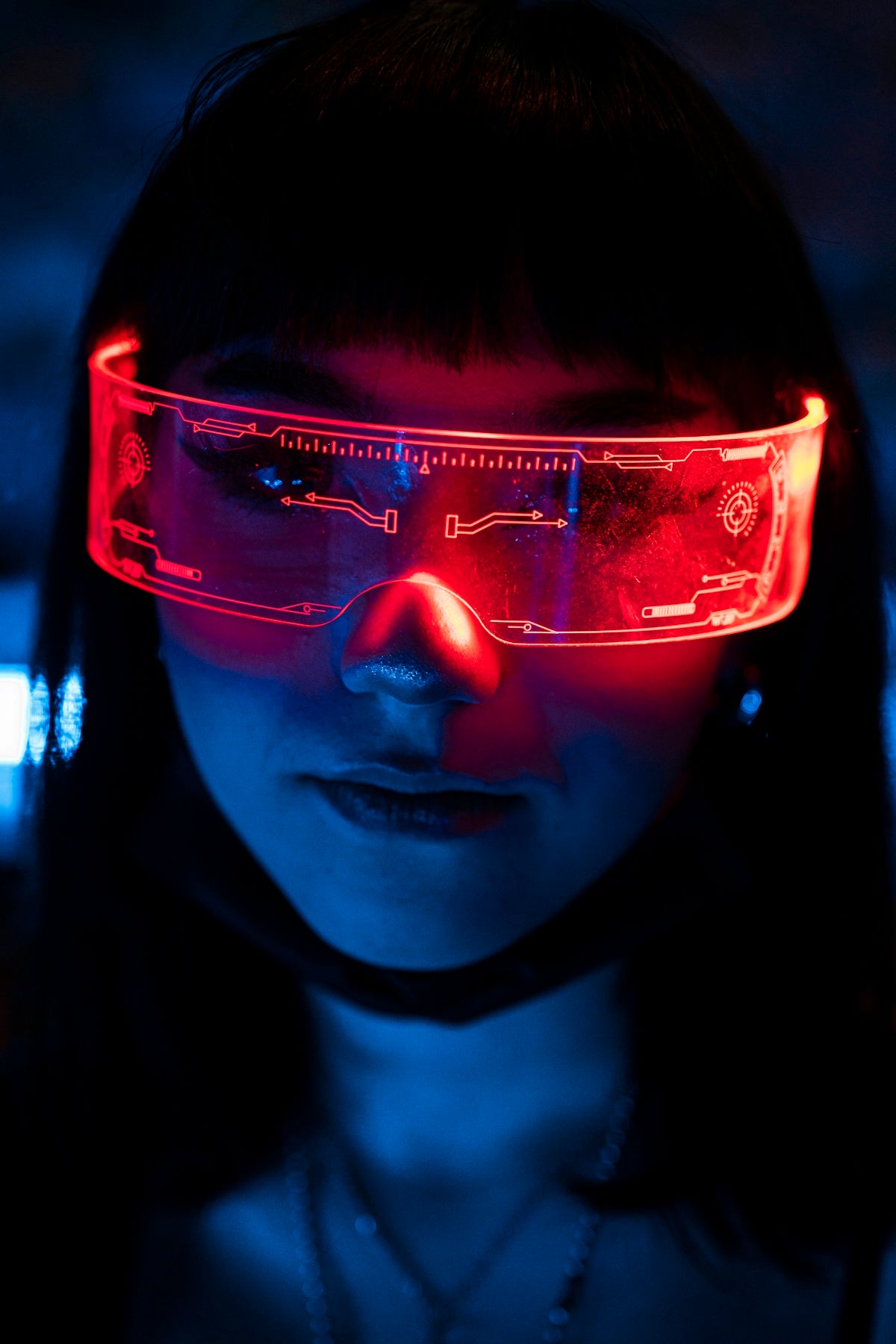 a woman wearing a pair of red glasses