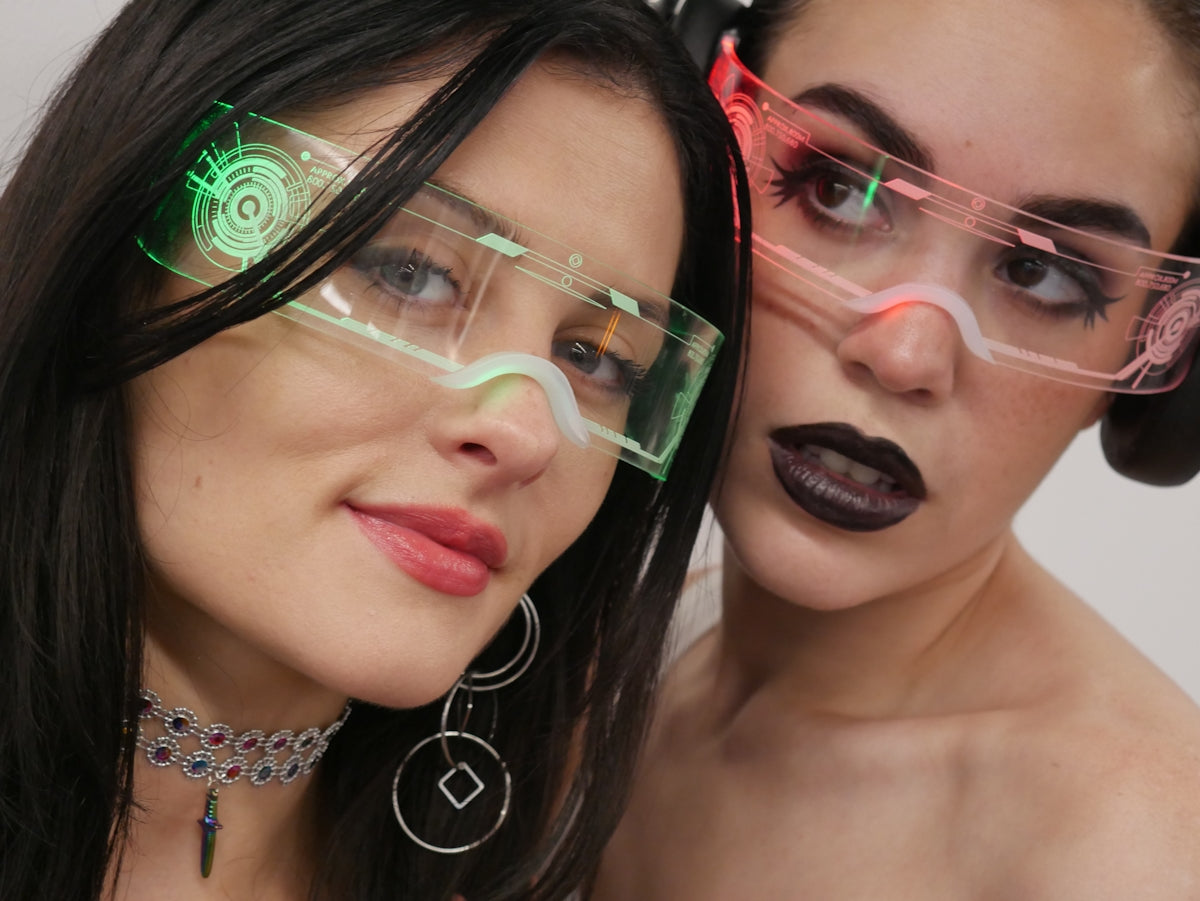 Two women with glasses on their faces posing for a picture
